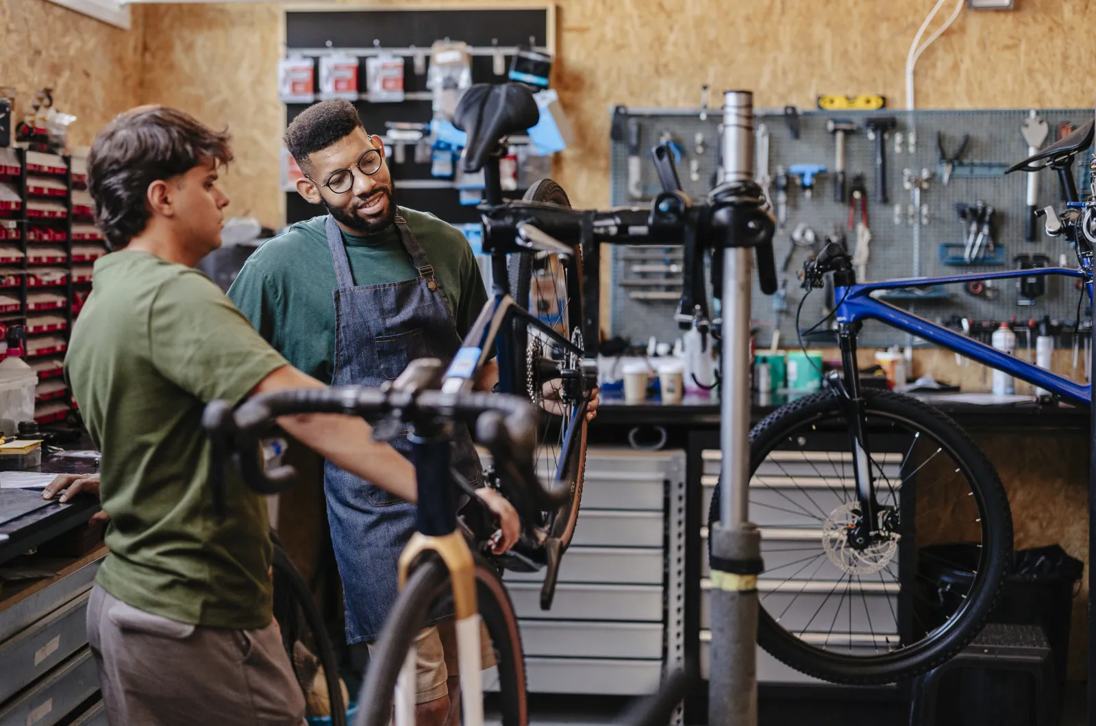 Bike shop interior with multiple bike categories racked together, the visual signature for a multi-category wholesale supplier